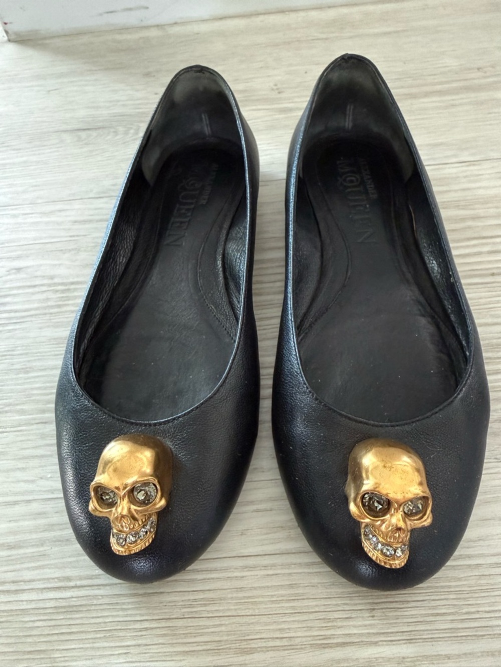 Alexander McQueen Black Leather Ballet Flats with Gold Skull Accents